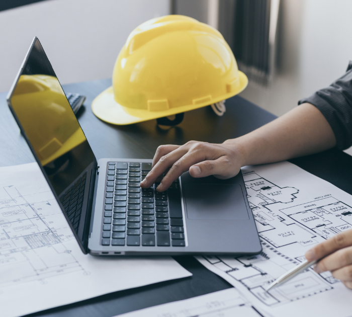 Engineering professional reviewing technical plans